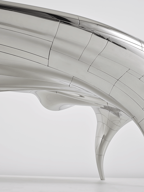 The ‘Lectori Salutem’ desk displays flowing curves